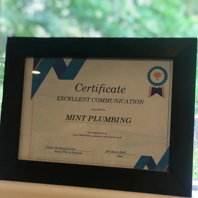 A framed Excellent Communication certificate awarded to Mint Plumbing