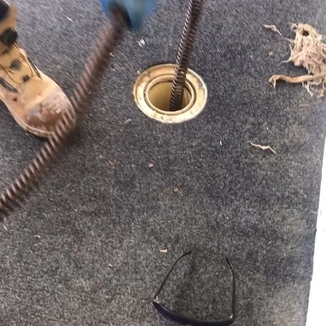 Coring through a carpeted floor around a floor waste on a commercial fit-out